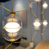 inder-nordic-glass-capsule-pendant-light-with-white-marble-and-metal-accents