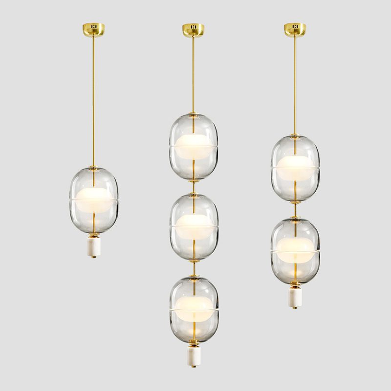 inder-nordic-glass-capsule-pendant-light-with-white-marble-and-metal-accents