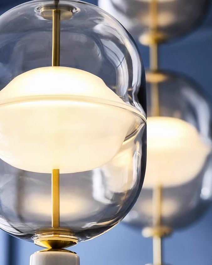 inder-nordic-glass-capsule-pendant-light-with-white-marble-and-metal-accents