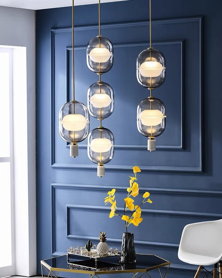 inder-nordic-glass-capsule-pendant-light-with-white-marble-and-metal-accents