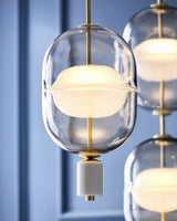 inder-nordic-glass-capsule-pendant-light-with-white-marble-and-metal-accents