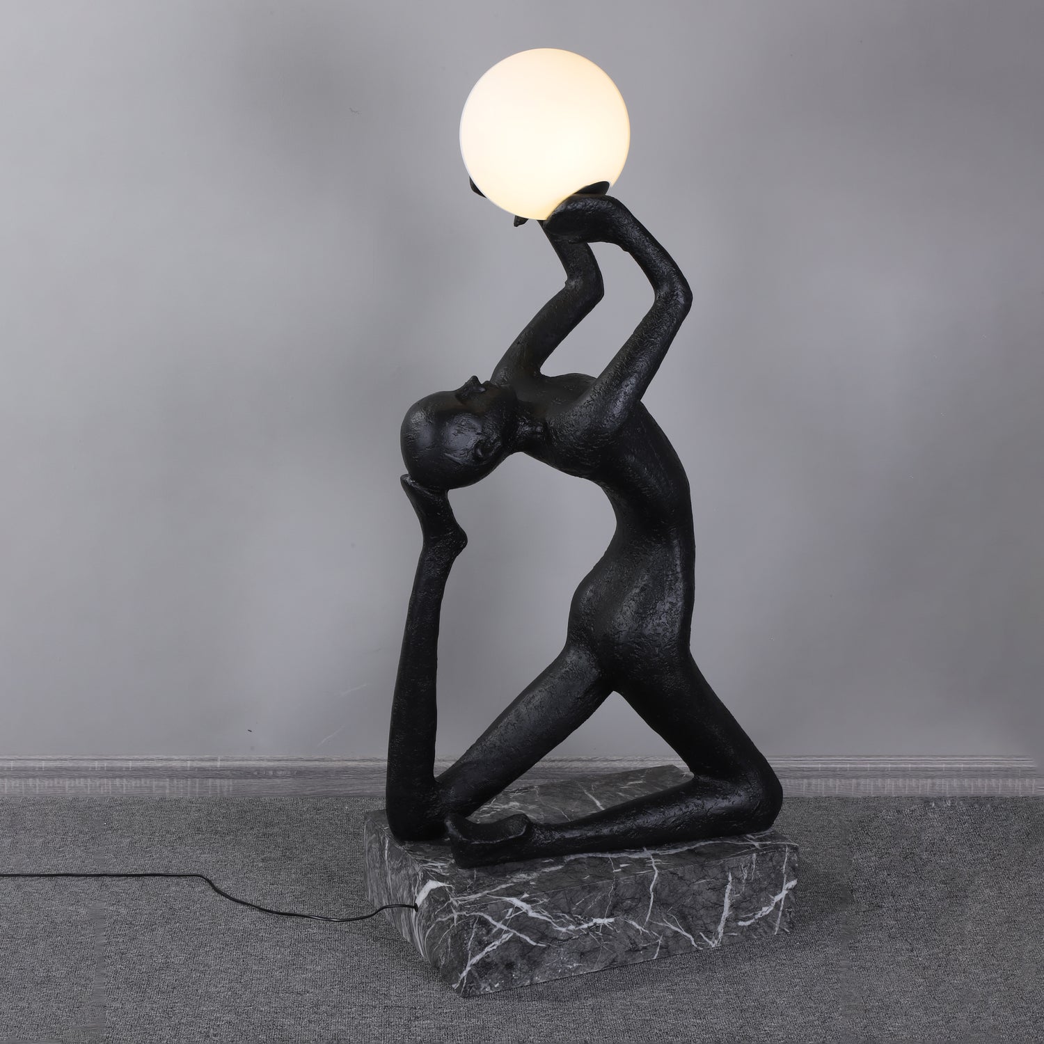 modern-artistic-human-figure-floor-lamp-with-luminous-glass-globe-sphere