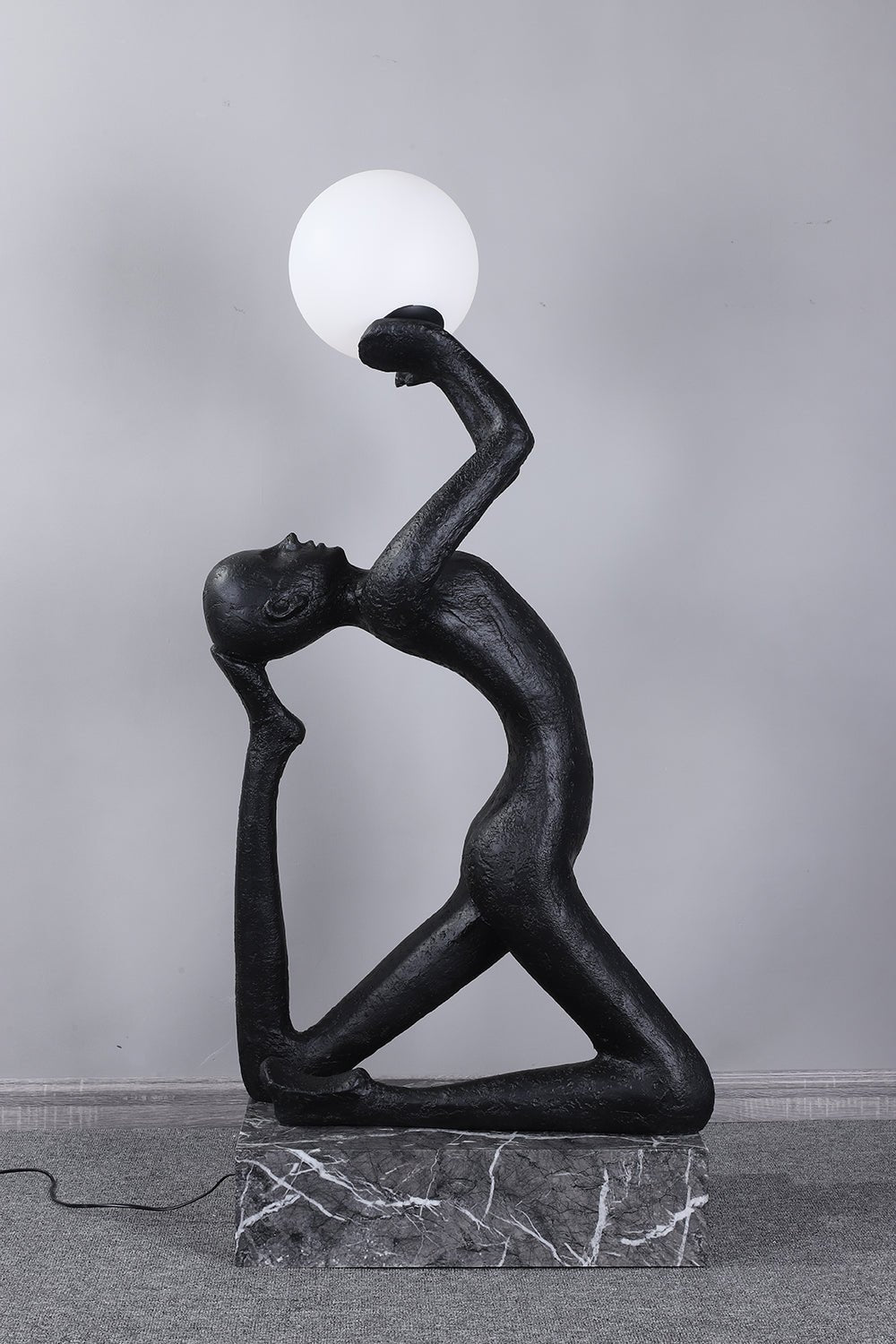 modern-artistic-human-figure-floor-lamp-with-luminous-glass-globe-sphere