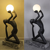modern-artistic-human-figure-floor-lamp-with-luminous-glass-globe-sphere