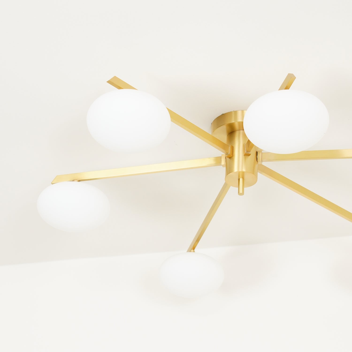 modern-jasper-glass-globe-ceiling-light-with-minimalist-metal-arms-and-oval-bulbs