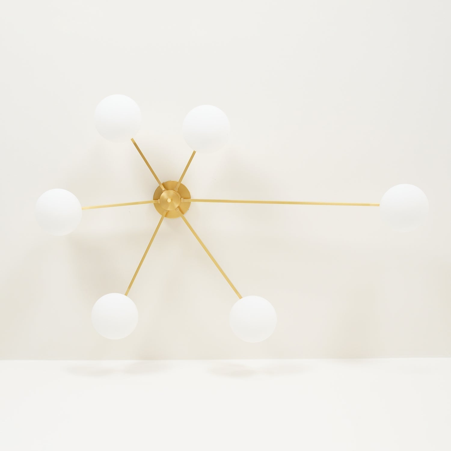 modern-jasper-glass-globe-ceiling-light-with-minimalist-metal-arms-and-oval-bulbs