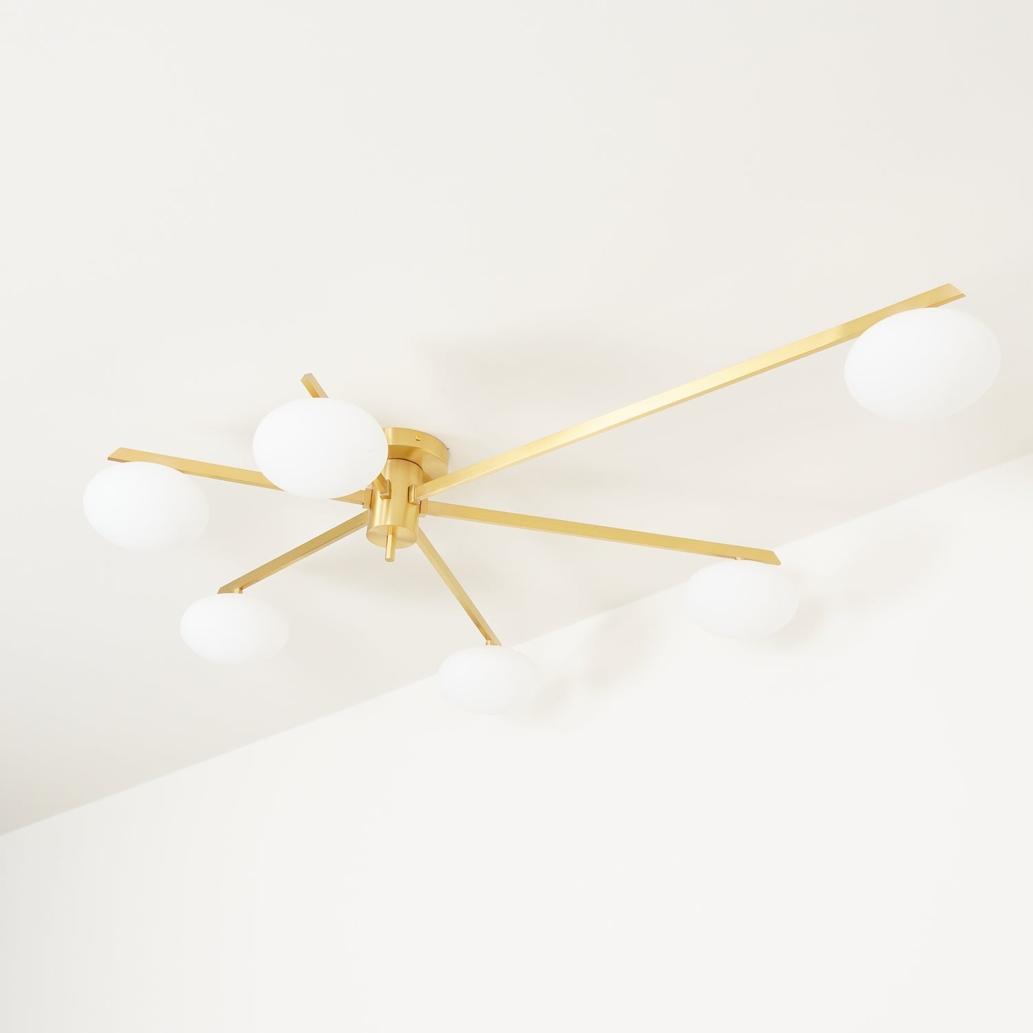 modern-jasper-glass-globe-ceiling-light-with-minimalist-metal-arms-and-oval-bulbs