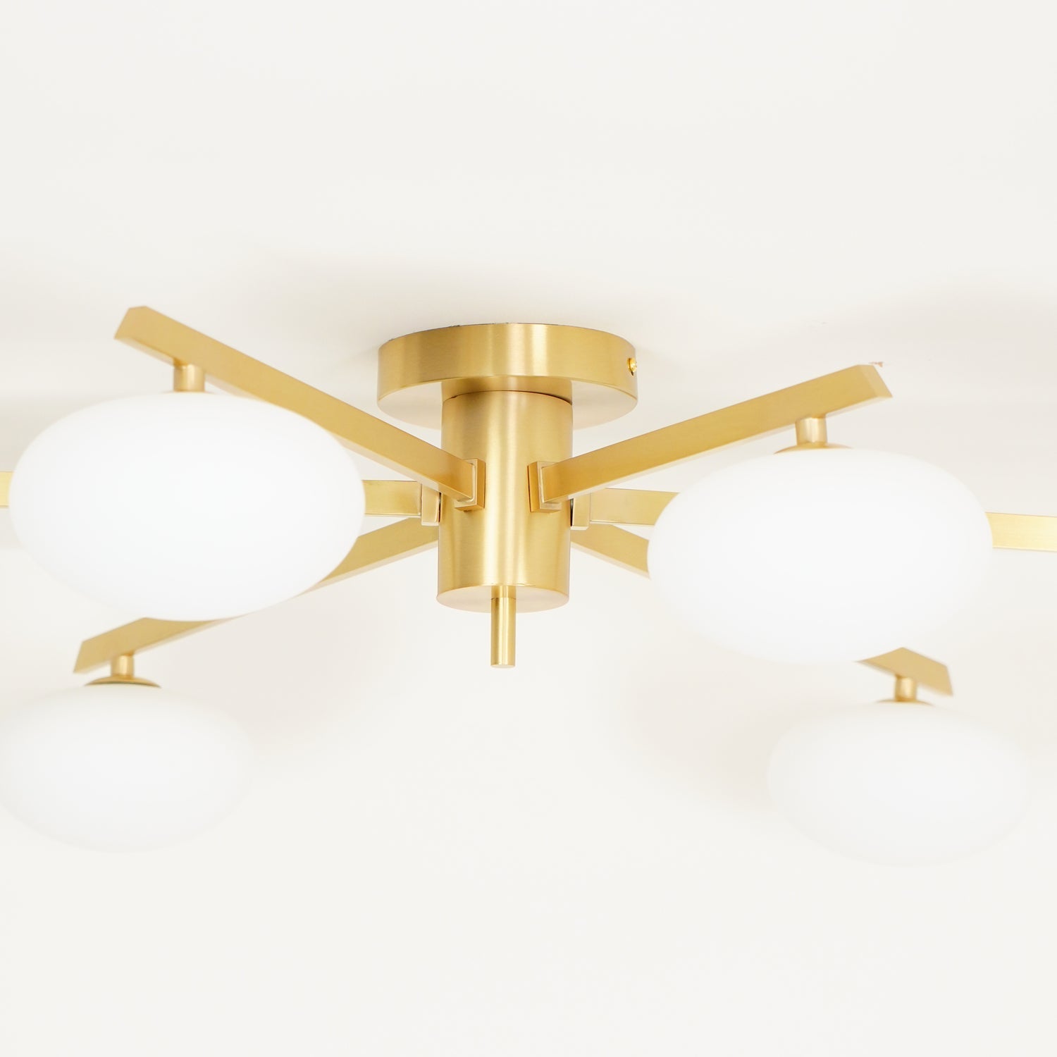 modern-jasper-glass-globe-ceiling-light-with-minimalist-metal-arms-and-oval-bulbs