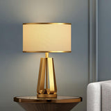Laila Antique Gold Table Lamp with Ivory Fabric Shade and Curved Metal Base