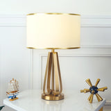 Laila Antique Gold Table Lamp with Ivory Fabric Shade and Curved Metal Base