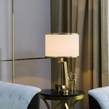 Laila Antique Gold Table Lamp with Ivory Fabric Shade and Curved Metal Base