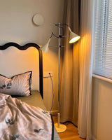 Modern Laiton Floor Lamp with Adjustable Arms Chrome Finish and Beige Fabric Shade
