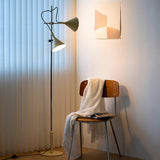 Modern Laiton Floor Lamp with Adjustable Arms Chrome Finish and Beige Fabric Shade