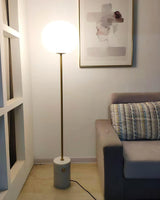 Modern Jwda Travertine Floor Lamp with Spherical Glass Globe and Yellow Stone Base