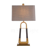 elegant-leather-texture-table-lamp-with-gold-metal-base-and-linen-shade
