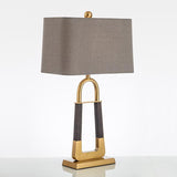 elegant-leather-texture-table-lamp-with-gold-metal-base-and-linen-shade