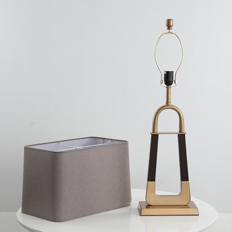 elegant-leather-texture-table-lamp-with-gold-metal-base-and-linen-shade