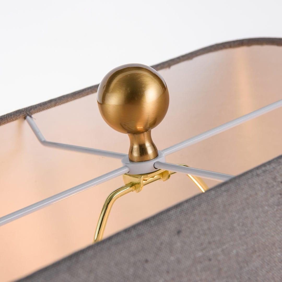 elegant-leather-texture-table-lamp-with-gold-metal-base-and-linen-shade
