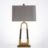 elegant-leather-texture-table-lamp-with-gold-metal-base-and-linen-shade