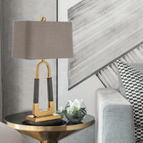 elegant-leather-texture-table-lamp-with-gold-metal-base-and-linen-shade