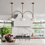 mid-century-modern-looping-brass-pendant-light-with-white-blown-glass-globes
