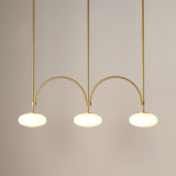 mid-century-modern-looping-brass-pendant-light-with-white-blown-glass-globes