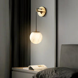 modern-alabaster-globe-wall-sconce-with-brass-accents-elegant-spherical-indoor-light