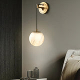 modern-alabaster-globe-wall-sconce-with-brass-accents-elegant-spherical-indoor-light
