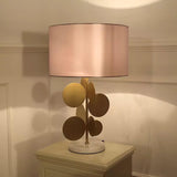 Sculptural Gold Metal Circle Table Lamp with Marble Base and White Fabric Shade for Modern Decor