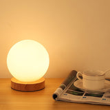 minimalist-mini-moon-wooden-desk-lamp-with-white-glass-globe-shade-for-bedside