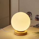 minimalist-mini-moon-wooden-desk-lamp-with-white-glass-globe-shade-for-bedside
