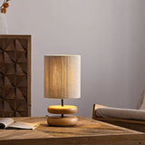 polished-walnut-stacked-oval-base-table-lamp-with-classic-beige-fabric-lampshade
