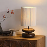 polished-walnut-stacked-oval-base-table-lamp-with-classic-beige-fabric-lampshade