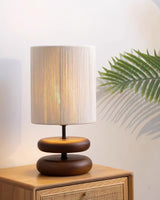 polished-walnut-stacked-oval-base-table-lamp-with-classic-beige-fabric-lampshade