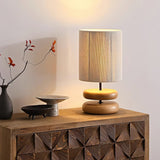 polished-walnut-stacked-oval-base-table-lamp-with-classic-beige-fabric-lampshade