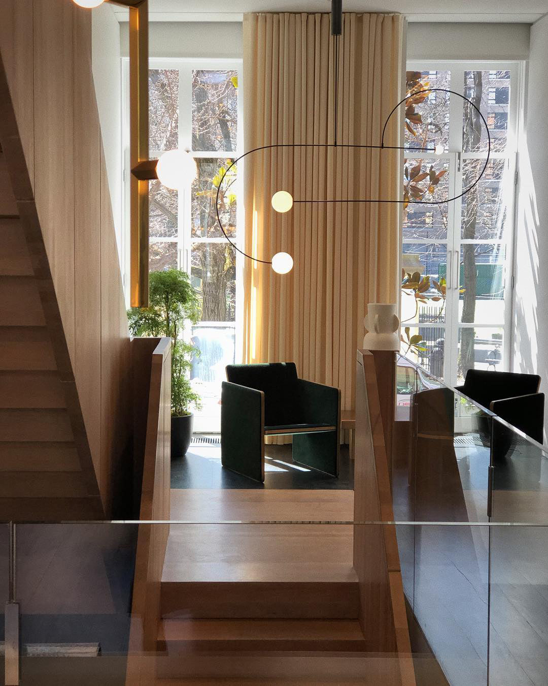 Modern Minimalist Linear Mobile Chandelier with Opal Glass Globes and Black Finish