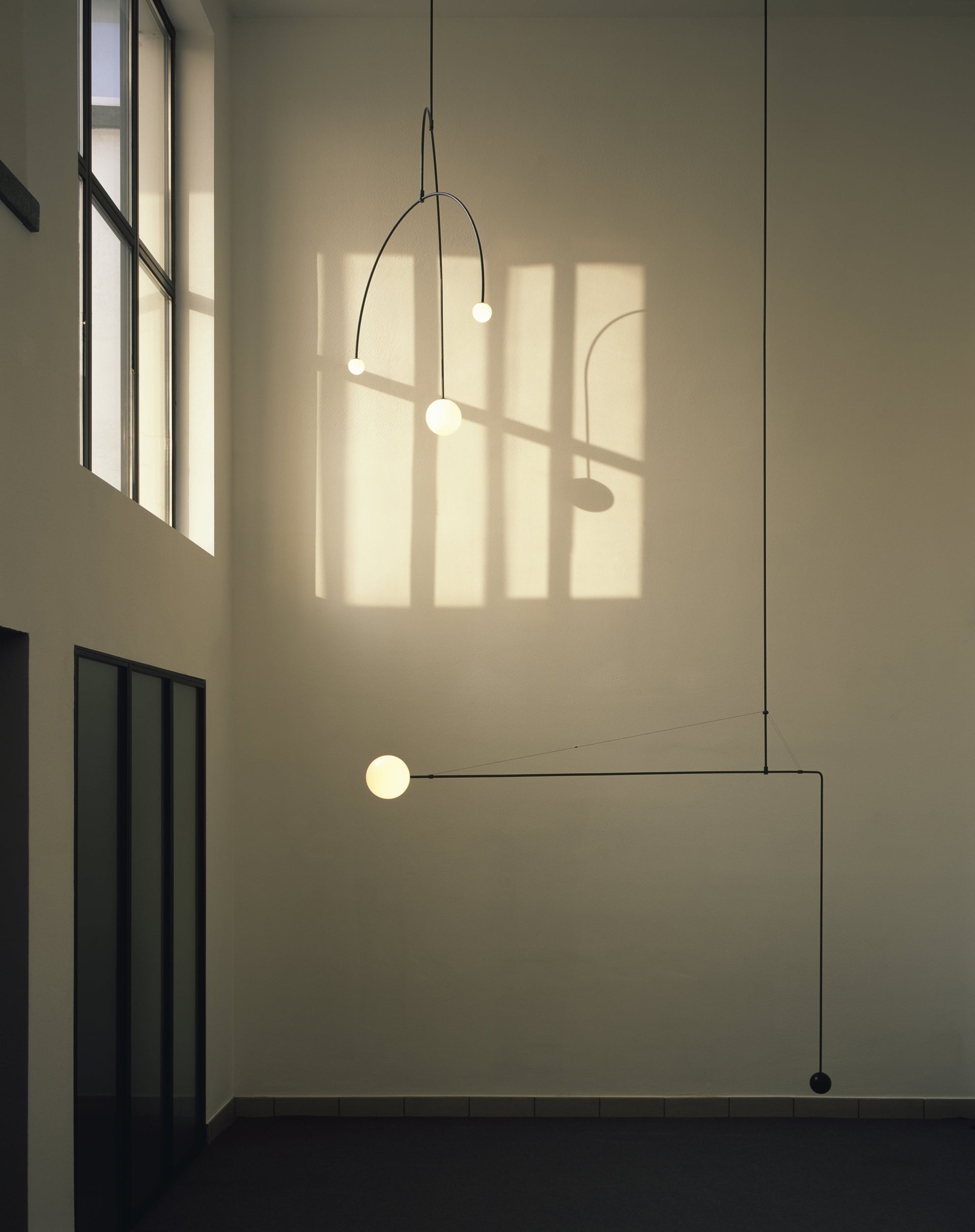Modern Minimalist Linear Mobile Chandelier with Opal Glass Globes and Black Finish