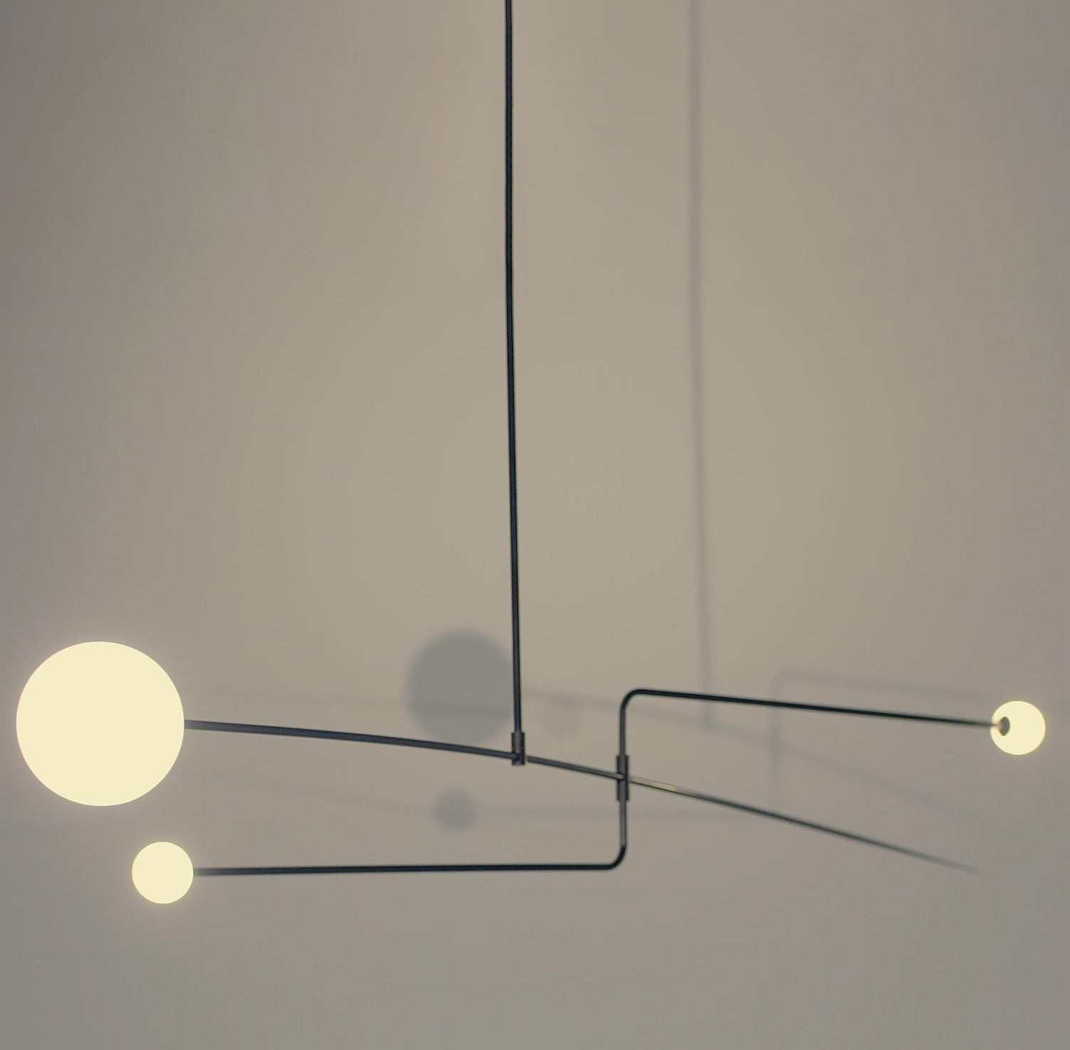 Modern Minimalist Linear Mobile Chandelier with Opal Glass Globes and Black Finish
