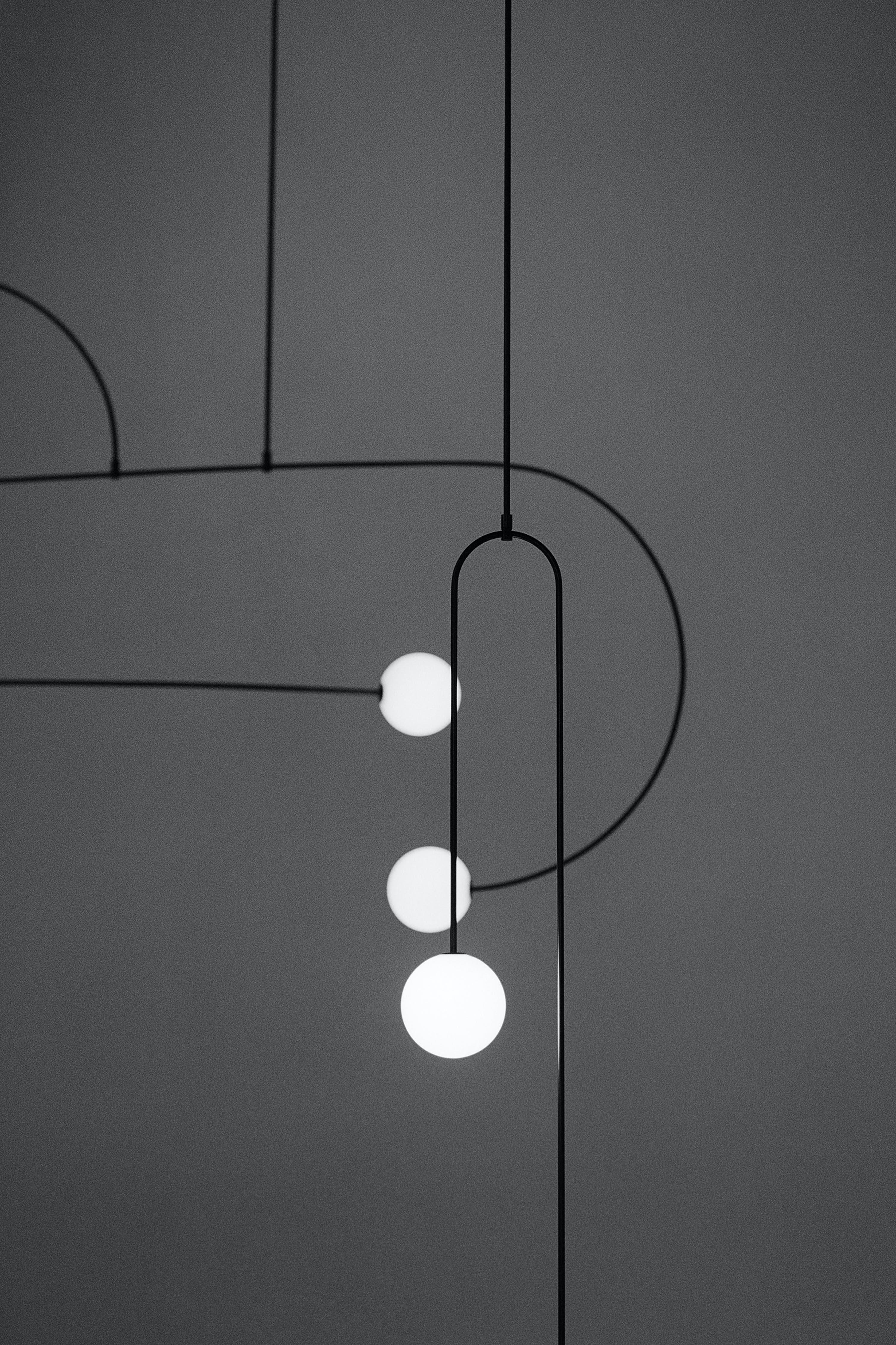 Modern Minimalist Linear Mobile Chandelier with Opal Glass Globes and Black Finish