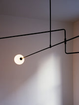 Modern Minimalist Linear Mobile Chandelier with Opal Glass Globes and Black Finish