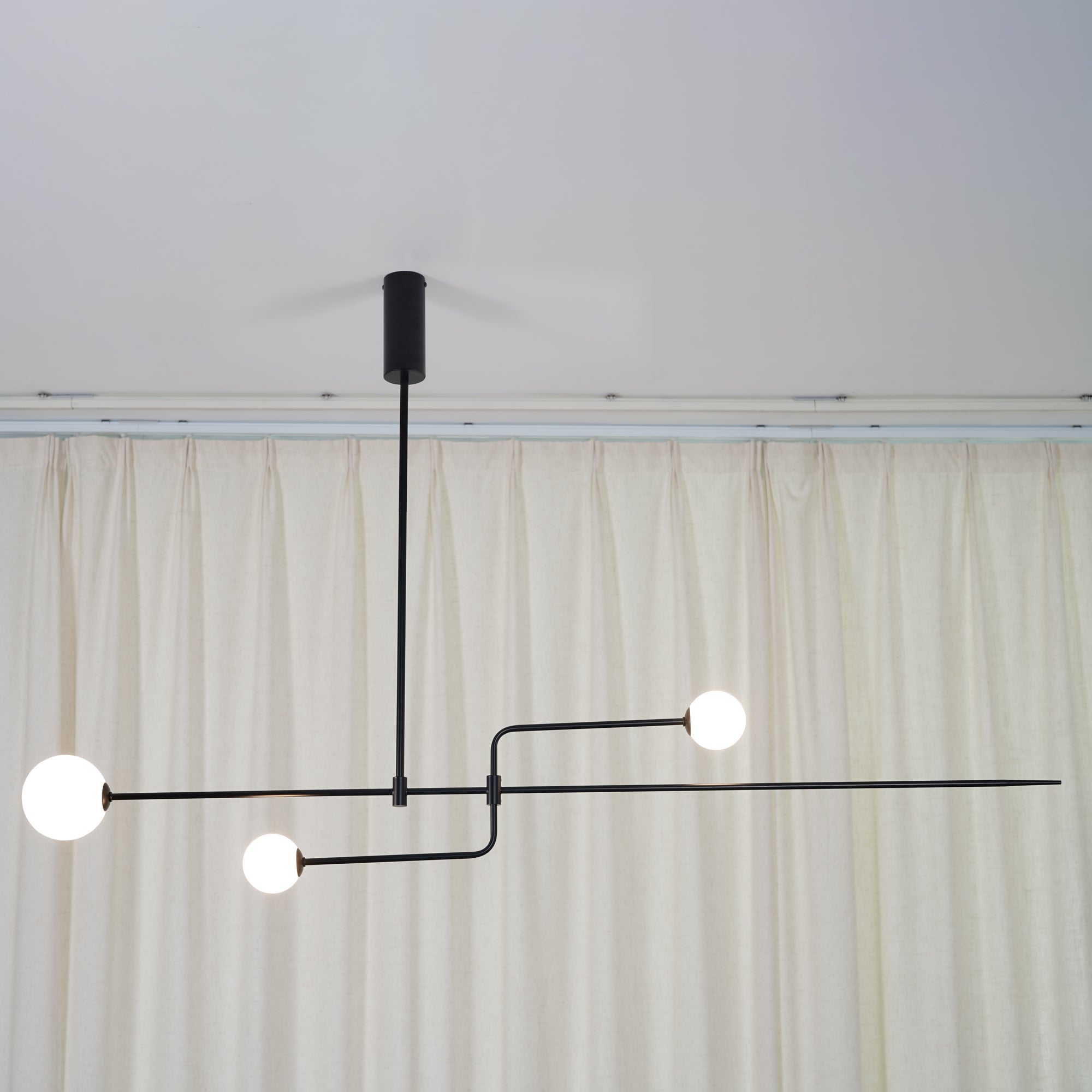Modern Minimalist Linear Mobile Chandelier with Opal Glass Globes and Black Finish