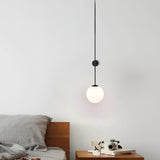 modern-brass-and-opal-glass-sphere-mobile-wall-sconce-lighting-for-indoor-spaces
