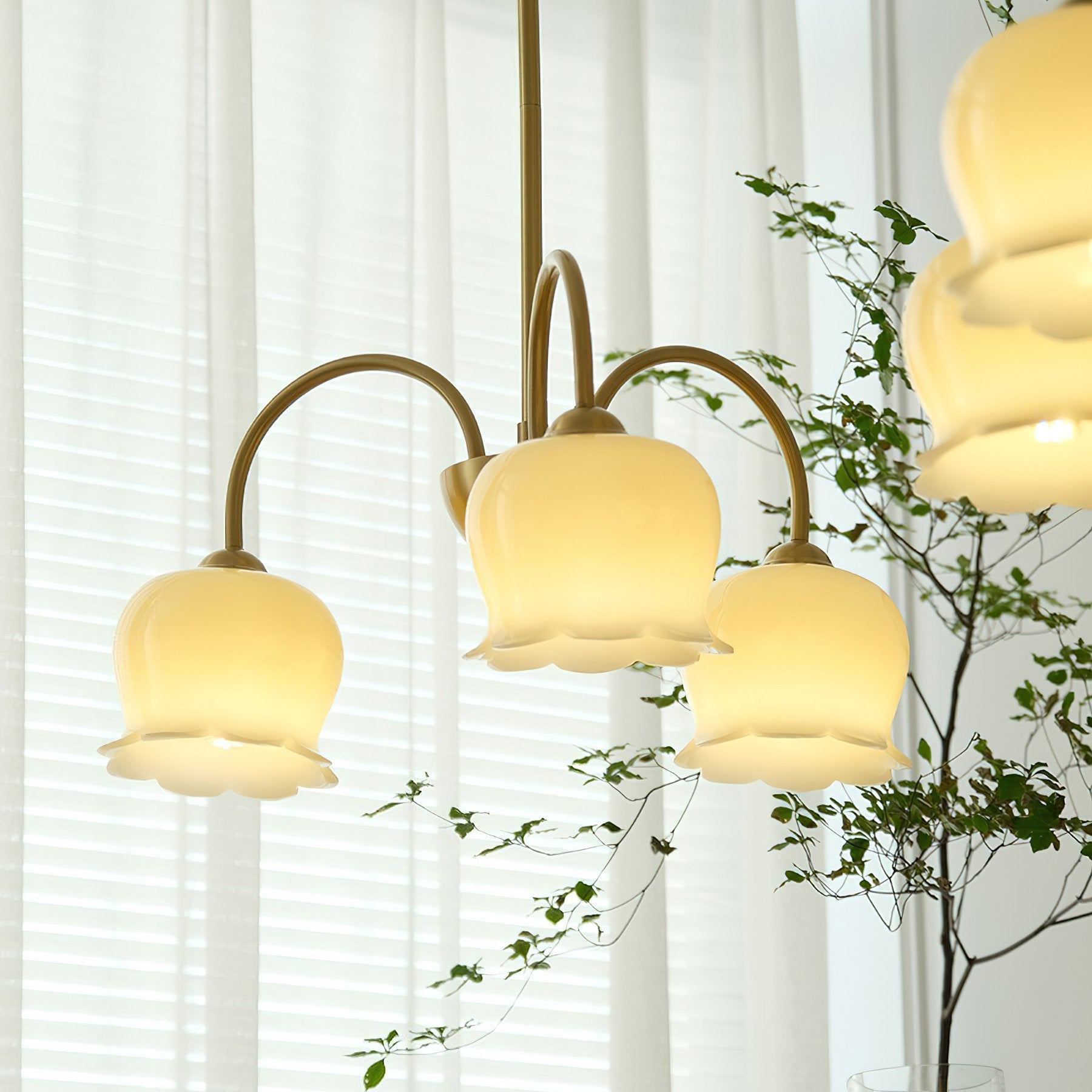 morup-elegant-floral-brass-and-resin-chandelier-with-shimmering-arches-and-cream-accents