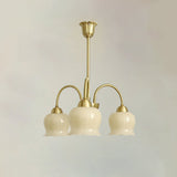 morup-elegant-floral-brass-and-resin-chandelier-with-shimmering-arches-and-cream-accents