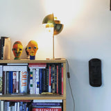 modern-sculptural-spherical-table-lamp-with-adjustable-metal-shades-and-copper-finish