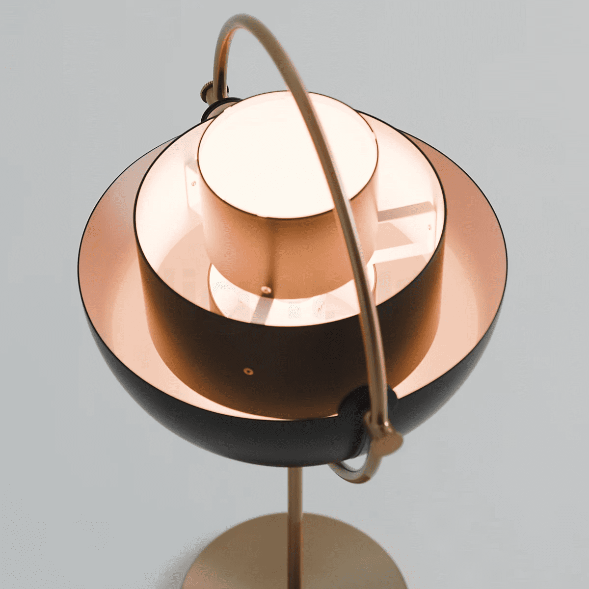 modern-sculptural-spherical-table-lamp-with-adjustable-metal-shades-and-copper-finish