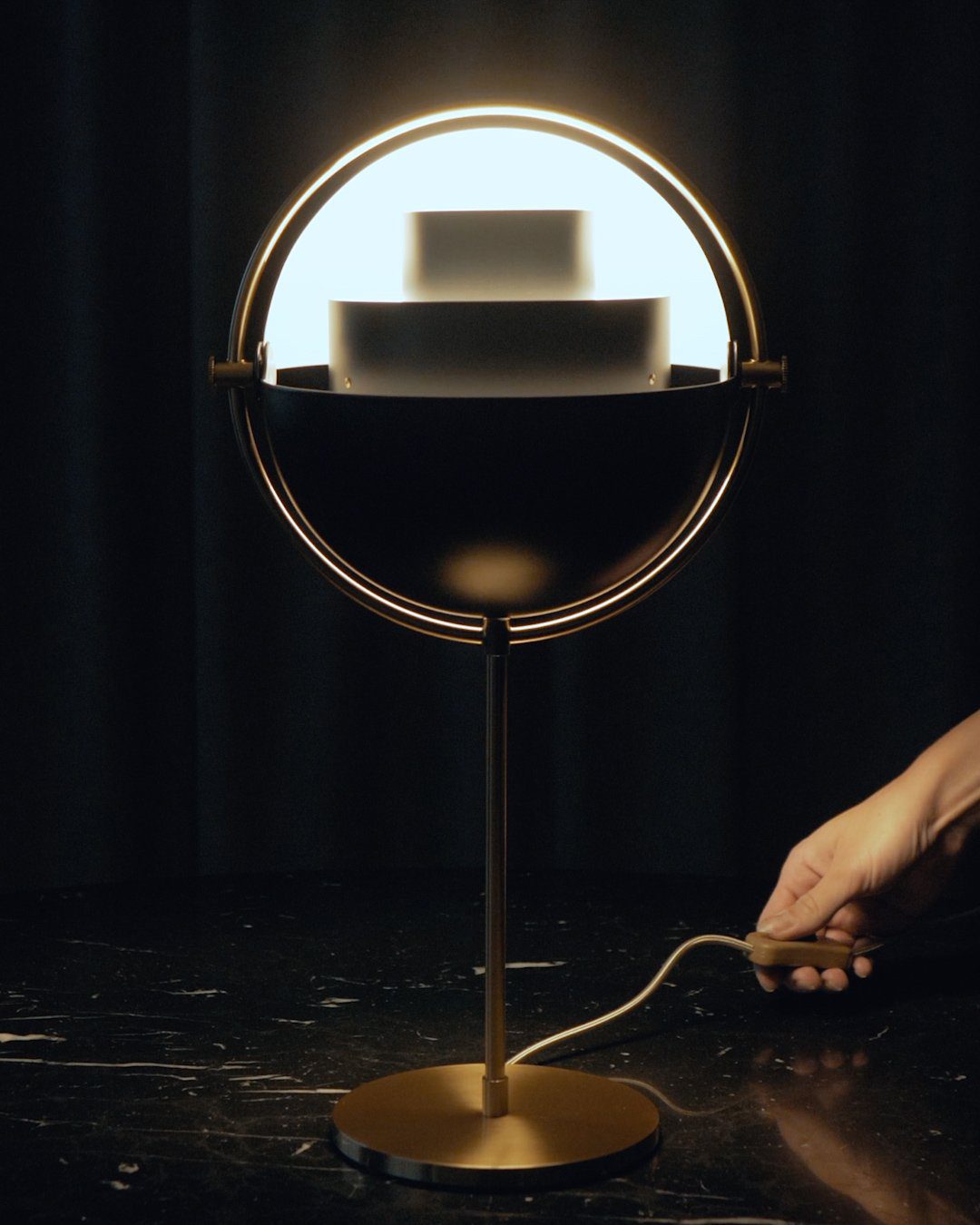 modern-sculptural-spherical-table-lamp-with-adjustable-metal-shades-and-copper-finish