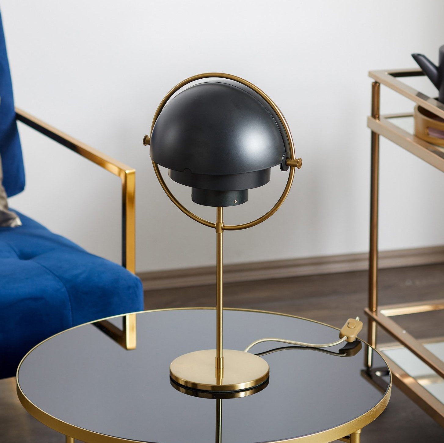 modern-sculptural-spherical-table-lamp-with-adjustable-metal-shades-and-copper-finish