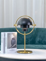 modern-sculptural-spherical-table-lamp-with-adjustable-metal-shades-and-copper-finish