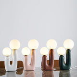 modern-resin-globe-table-lamp-with-sculptural-base-for-designer-home-decor